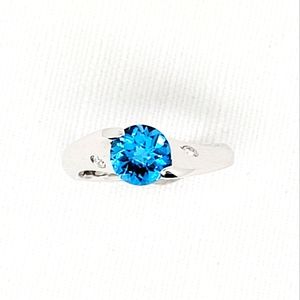Curved design Tension set Ring w London blue Topaz